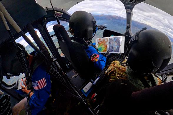 NASA astronauts Matthew Dominick (left) and Mark Vande Hei (right) prepare to fly out to a landing zone in the Rocky Mountains as part of the certification run for the NASA Artemis course at the High-Altitude Army National Guard Aviation Training Site in Gypsum, Colorado, Aug. 26.
