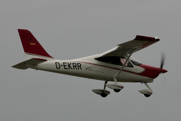 A Tecnam P2008 single-engine high-wing light aircraft during approach to land