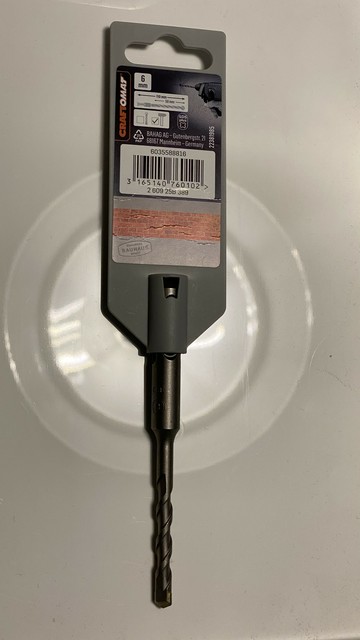 Ein einzelner Bohrer der Firma Craftomat in einer Hartplastikverpackung. 