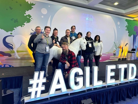 My awesome colleagues from REWE Digital and me next to the Agile Testing Days Unicorn.