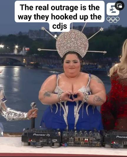 Screenshot from the olympic opening ceremony:

A plus size model standing behind two Pioneer DJ CD players and a mixer, but the CD players are connected to the same channel on the mixer and the output of the mixer is not connected to anything.

Text over the image: The real outrage is the way the hooked up the cdjs.
