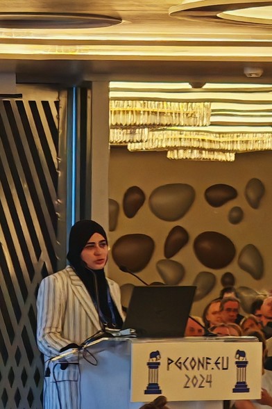 Rafia Sabih standing behind the representation desk