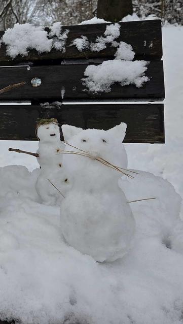 Photo of a snowcat (snowman in the shape of a cat)